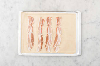 Warm tortillas and bake bacon