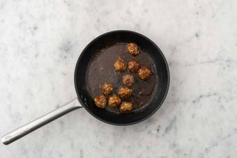 Cook broccoli and glaze meatballs