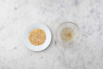 Toast pine nuts and make vinaigrette