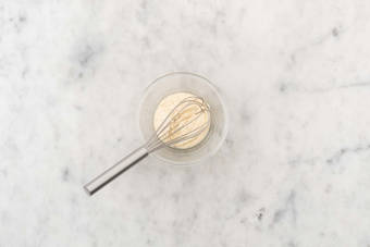 Make garlic-hummus dressing