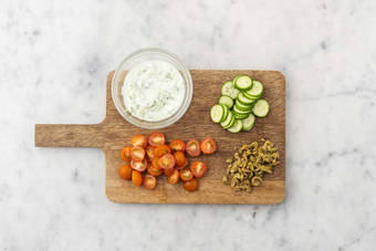 Prep and mix cucumber yogurt sauce