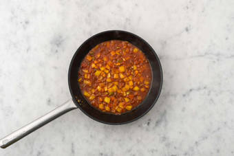 Cook tomatoes and peppers