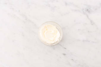 Warm tortillas and make crema