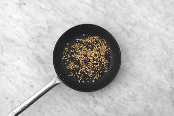 Toast pine nuts and prep