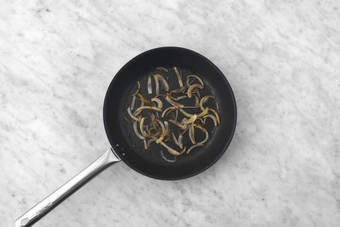 Cook onions and prep mushrooms