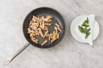 Fry sage and cook pork