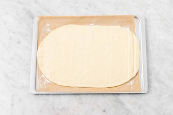 Stretch dough and cook bacon