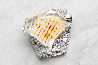 Warm tortillas and finish salmon