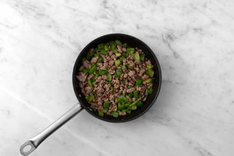 Cook beef and peppers
