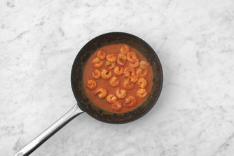 Make red sauce and cook shrimp