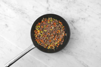 Cook aromatics and Beyond Meat®