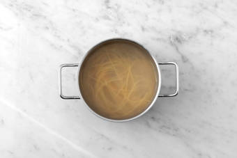 Cook spaghetti and corn