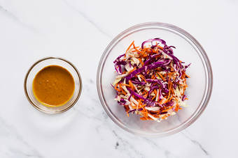 Make slaw and peanut sauce