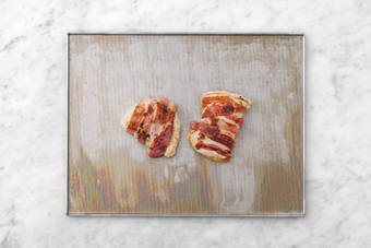 Cook bacon-wrapped chicken