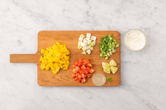 Prep veggies and make lime crema