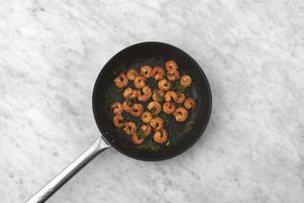 Cook shrimp and jalapeños