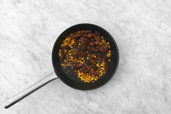 Cook plant-based protein and corn