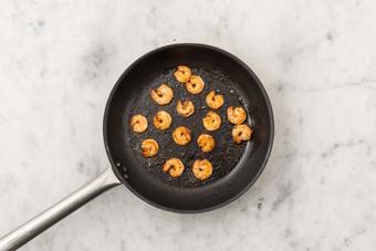 Cook peppers and shrimp