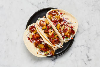 Heat tortillas and serve