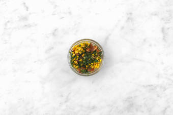 Make the tomato-corn salsa 