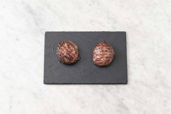 Toast buns and melt cheese