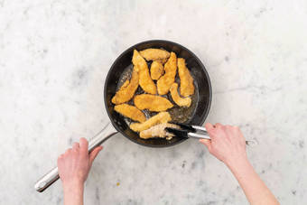 Cook the crumbed chicken