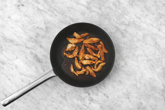 Cook the  plant-based crumbed chicken 