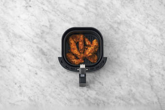 Cook the crumbed chicken