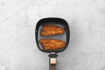 Cook the plant-based crumbed chicken