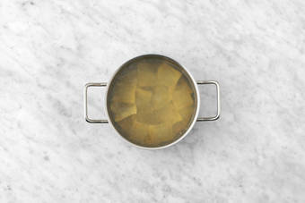 Cook ravioli and chicken