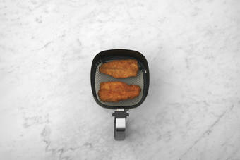 Cook the plant-based crumbed chicken