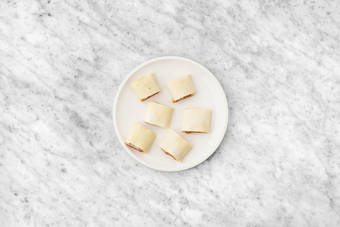 Assemble the sausage rolls