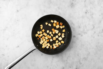 Cook chicken, tofu and pineapple