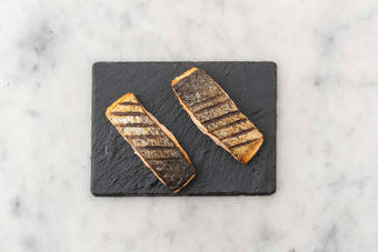 Season and grill tilapia