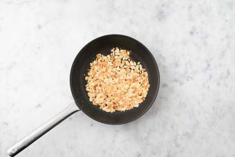 Make glaze and toast almonds