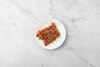 Marinate and skewer shrimp