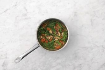 Simmer the curry & heat the flatbreads