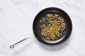 Toast pine nuts