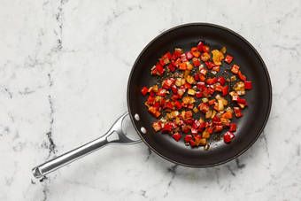 Cook peppers and onions