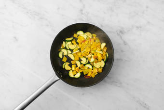 Cook chicken and veggies