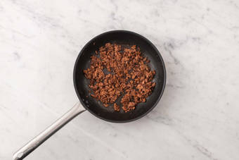 Cook plant-based protein shreds and beef