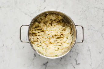 Mash potatoes and assemble pie