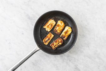 Cook the haloumi 