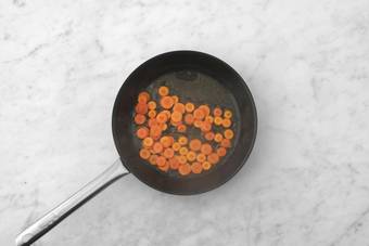 Cook carrots and microwave rice 