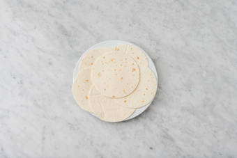 Toss the slaw & heat up tortillas