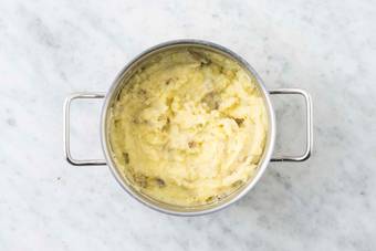 Melt butter and smash potatoes