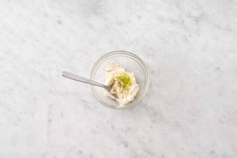 Make lime-yogurt sauce and finish bulgur