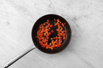 Sauté peppers and make harissa-honey
