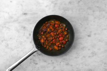 Stir your Chorrillana Sauce