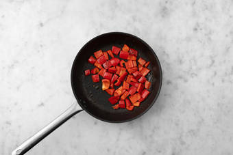 Cook peppers and marinate tomatoes